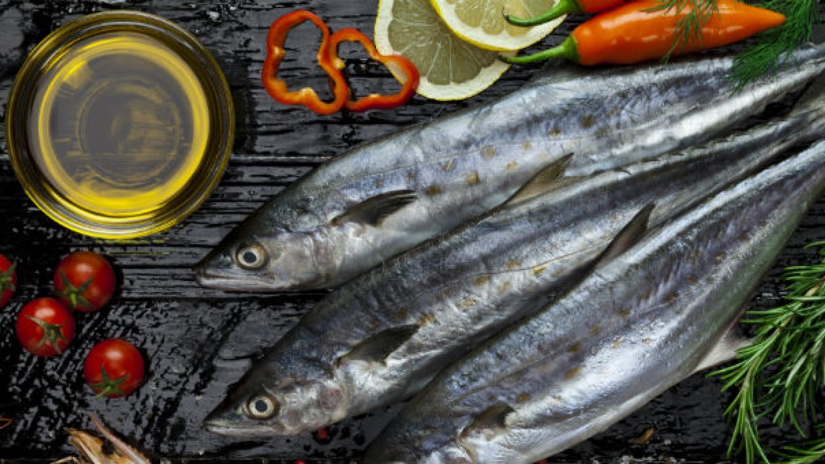 Vitamin D rich fish and other foods laid out on table.