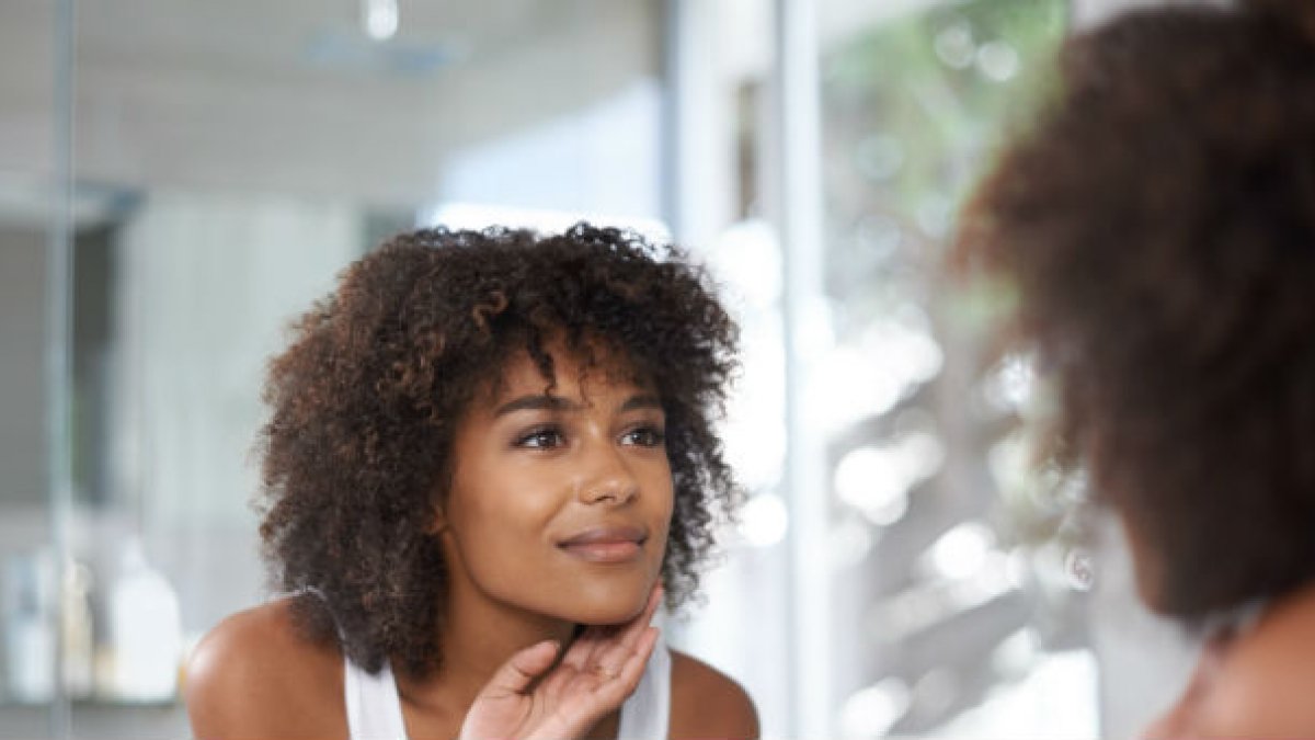 Woman looking in mirror