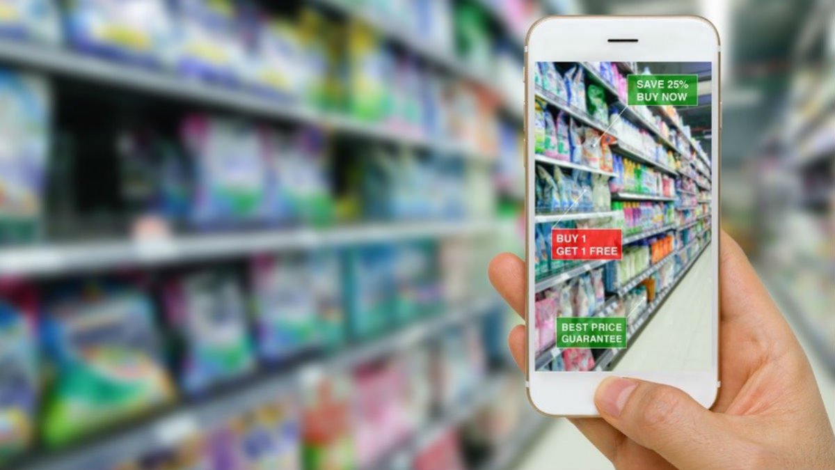 Smart phone showing a retail app on the screen in a supermarket