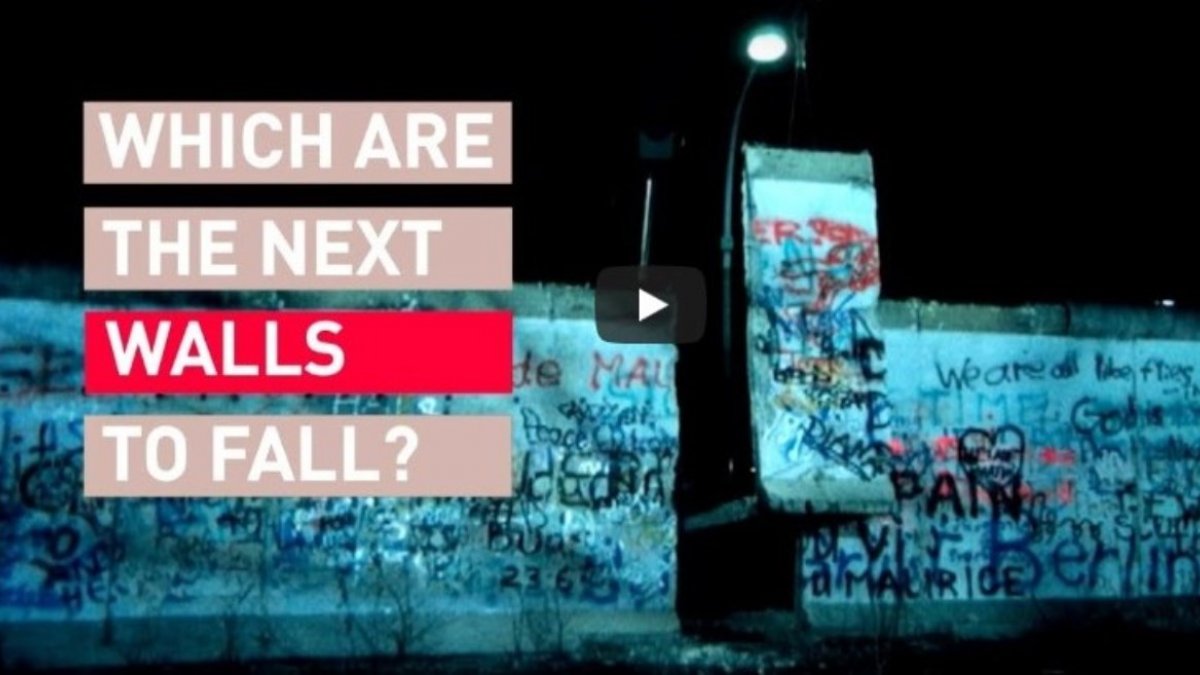 The Berlin Wall with 'Which are the next walls to fall?' written in text on top