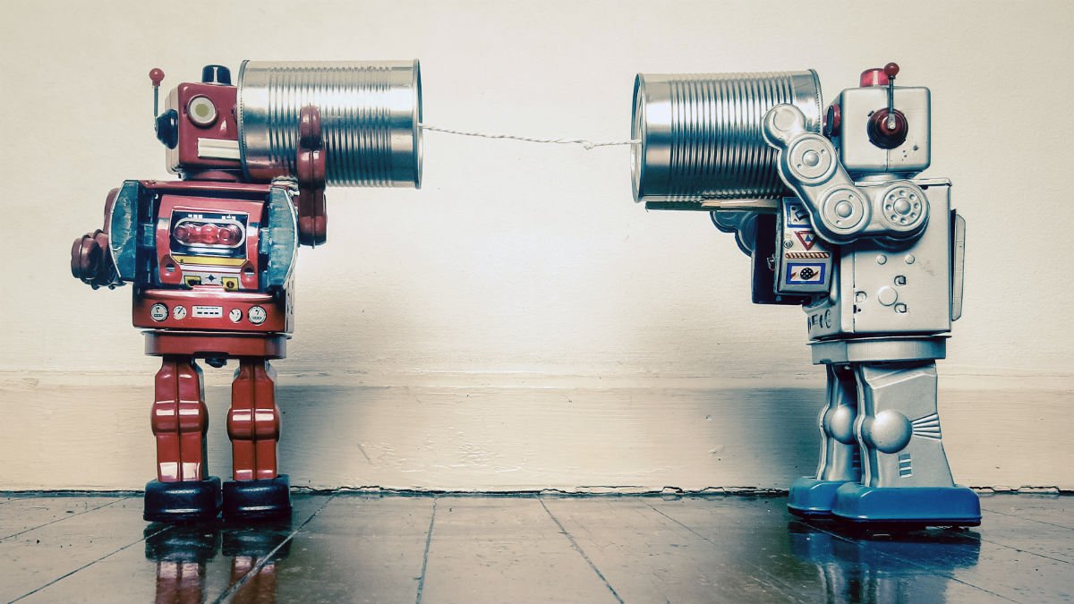 Two cute robots playing with a rope and cans to talk to each other
