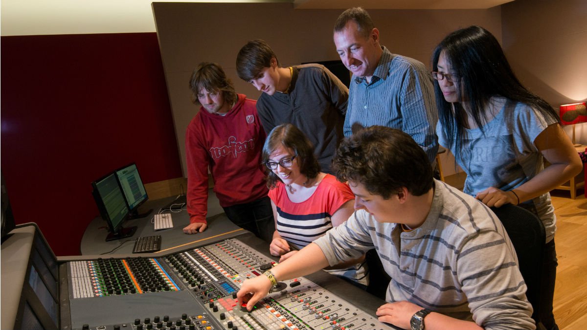 Professor Tony Myatt shows a group of Tonmeister students the mixing desk