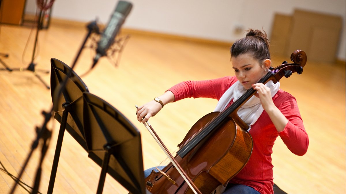 Cellist recording in studio