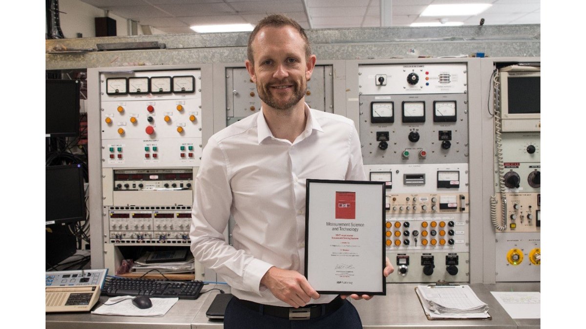 Dr M Hodgson with his award certificate