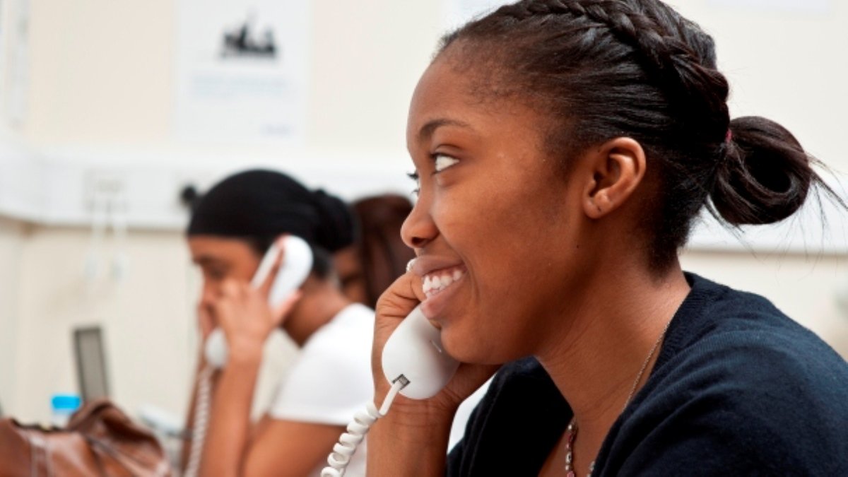 Student talking on the phone, smiling