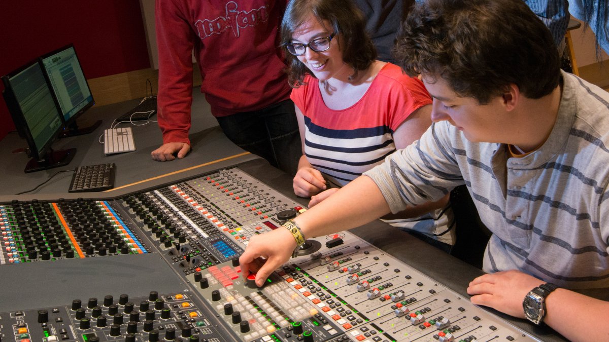 Male and female using equipment in studio 3