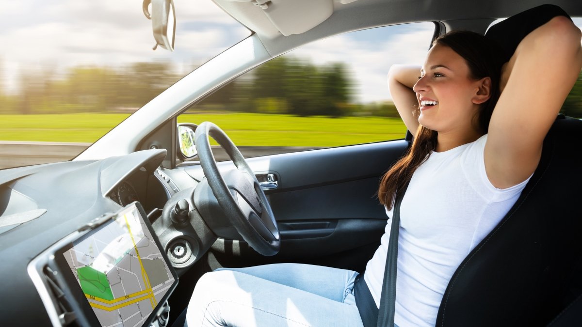 Woman in car seat on autonomous vehicle