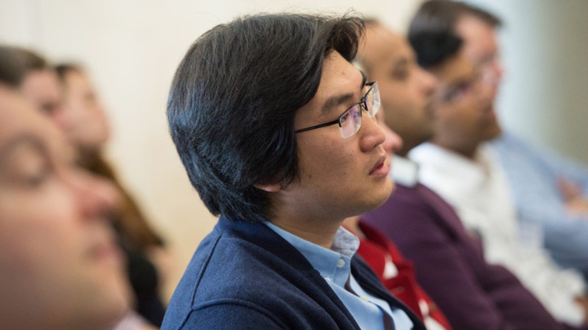 Students in a room listening to lecture
