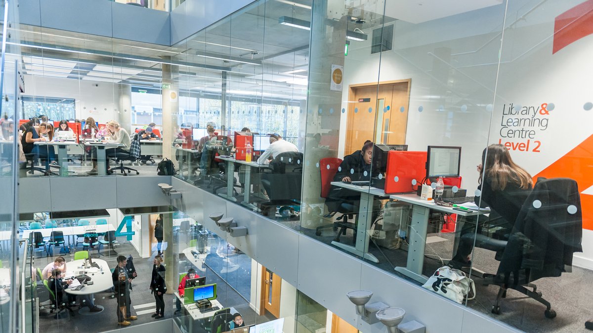 Several floors of the library with students using computers