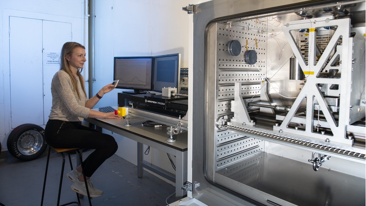 Student using mechanical engineering equipment