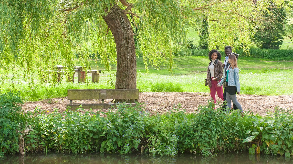 Students walking by river