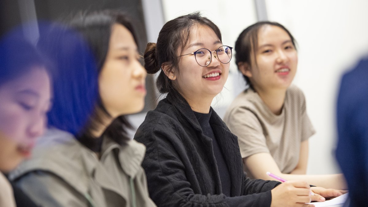 Smiling Chinese interpreting student 