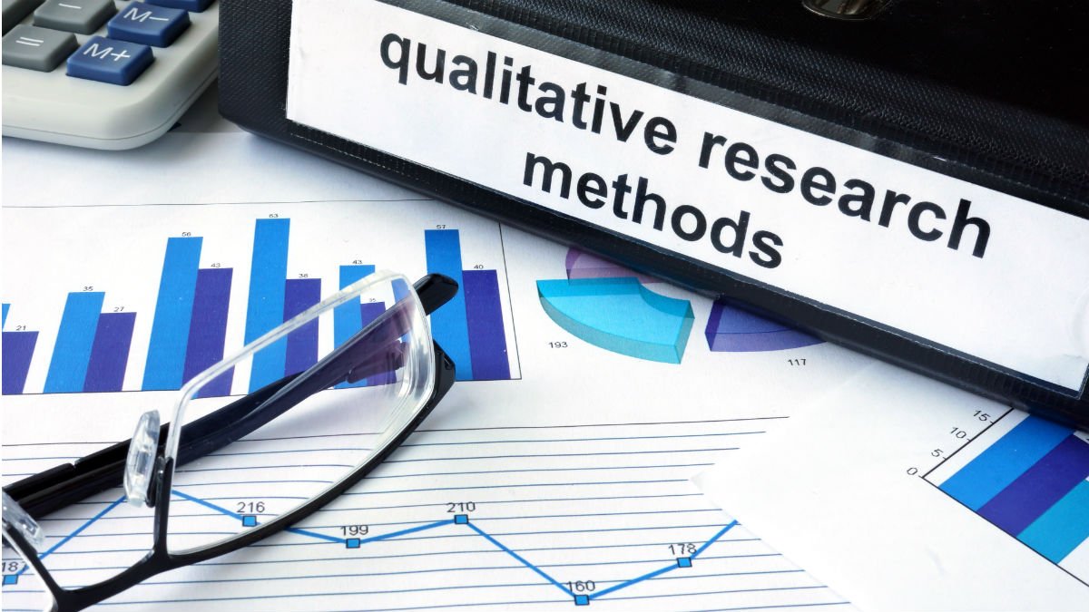 A desk with a Qualitative Research folder