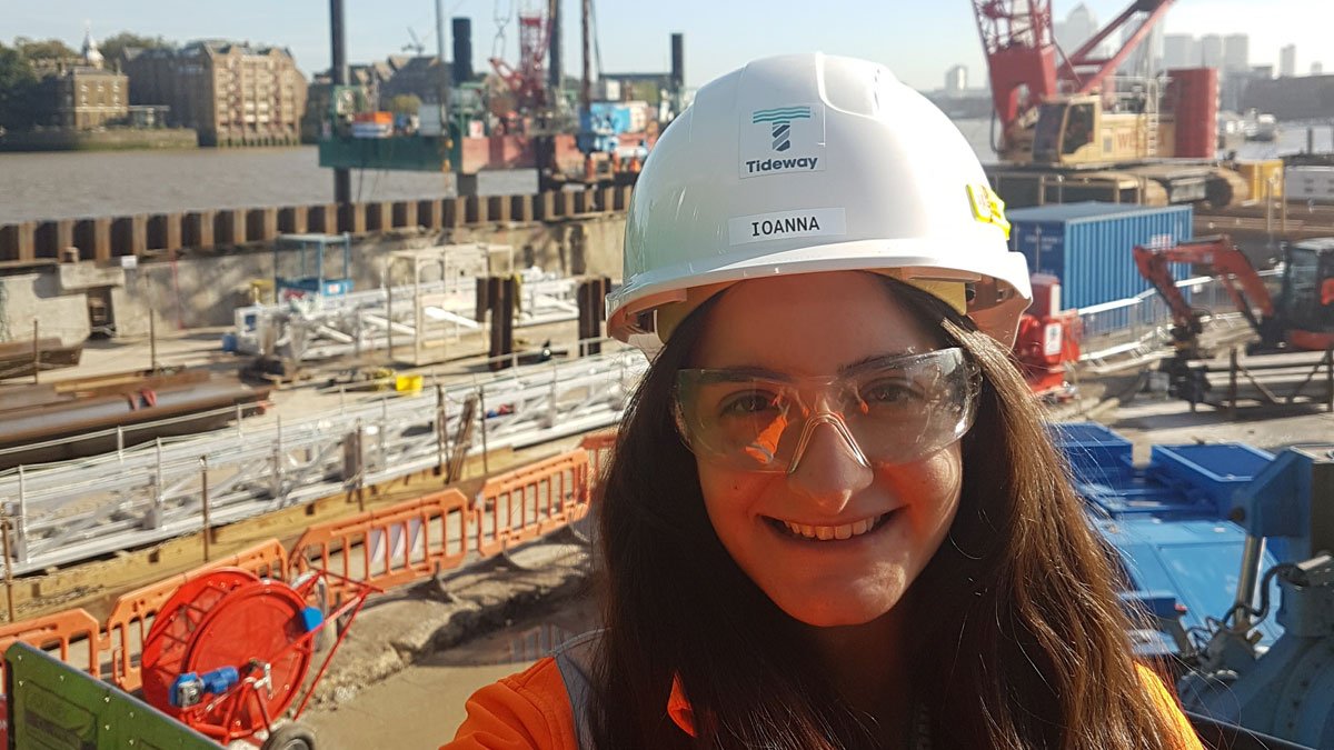 Ioanna stood with cranes in the background