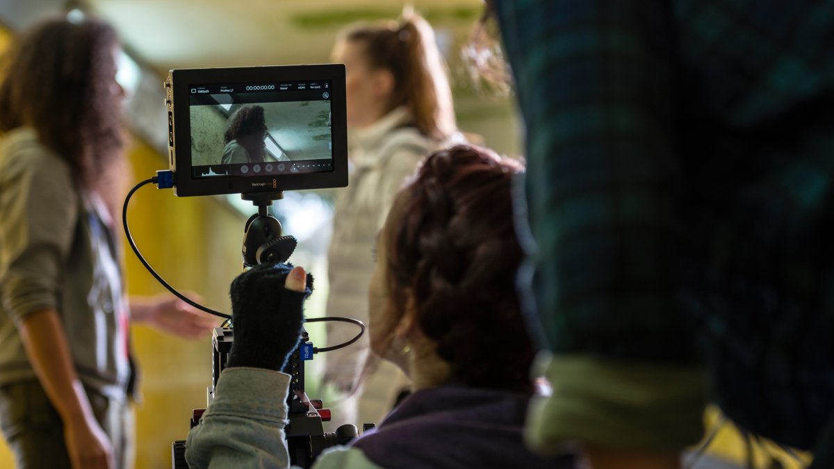 Two women being filmed acting