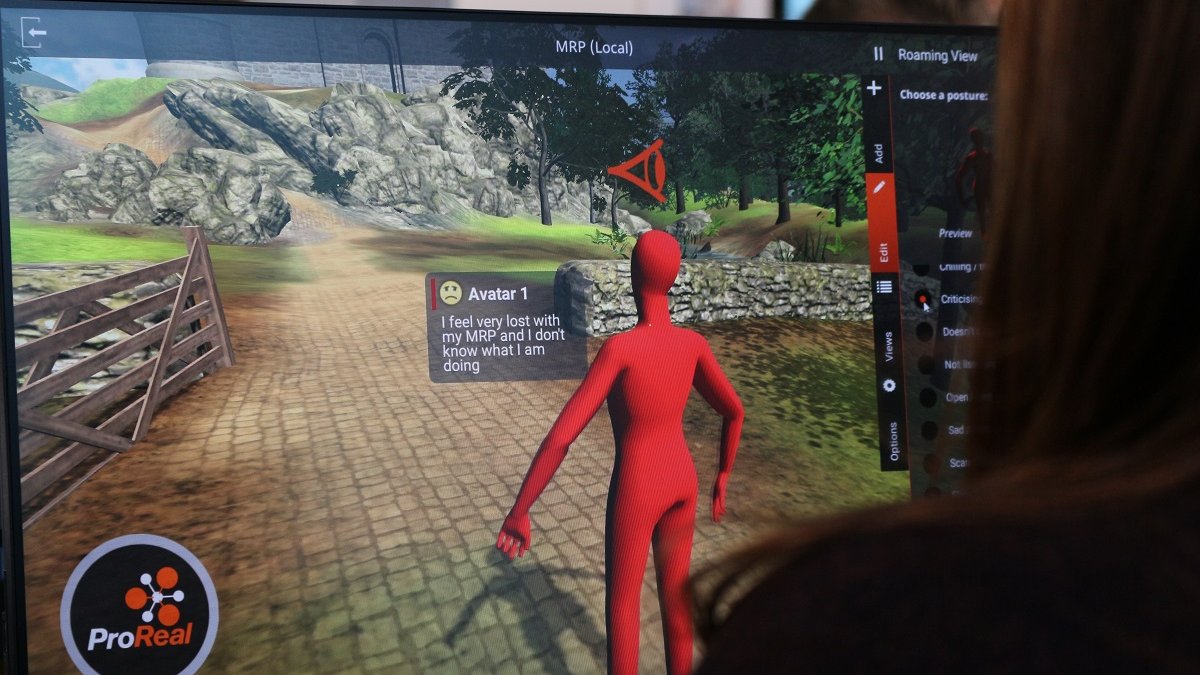 A person is on a PC, on the screen is an avatar explaining that it feels very lost.