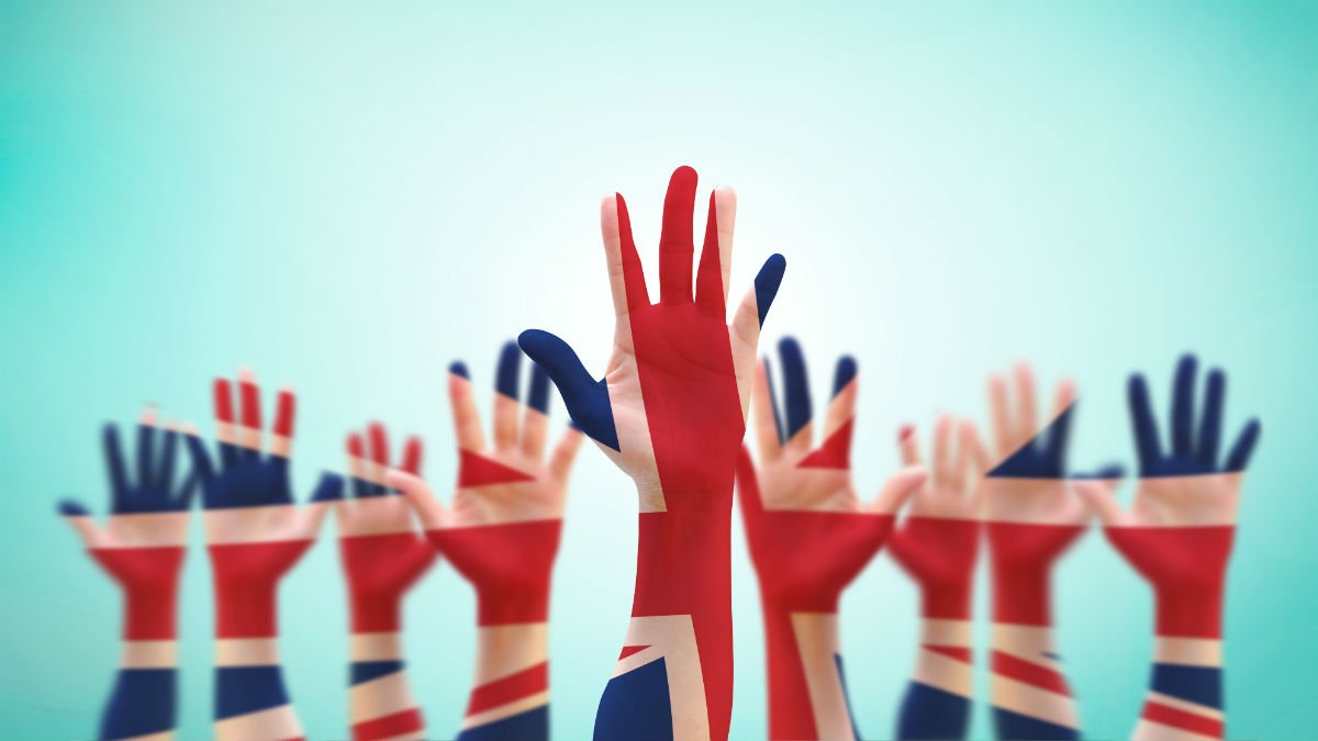 Hands are raised to vote in the UK general election