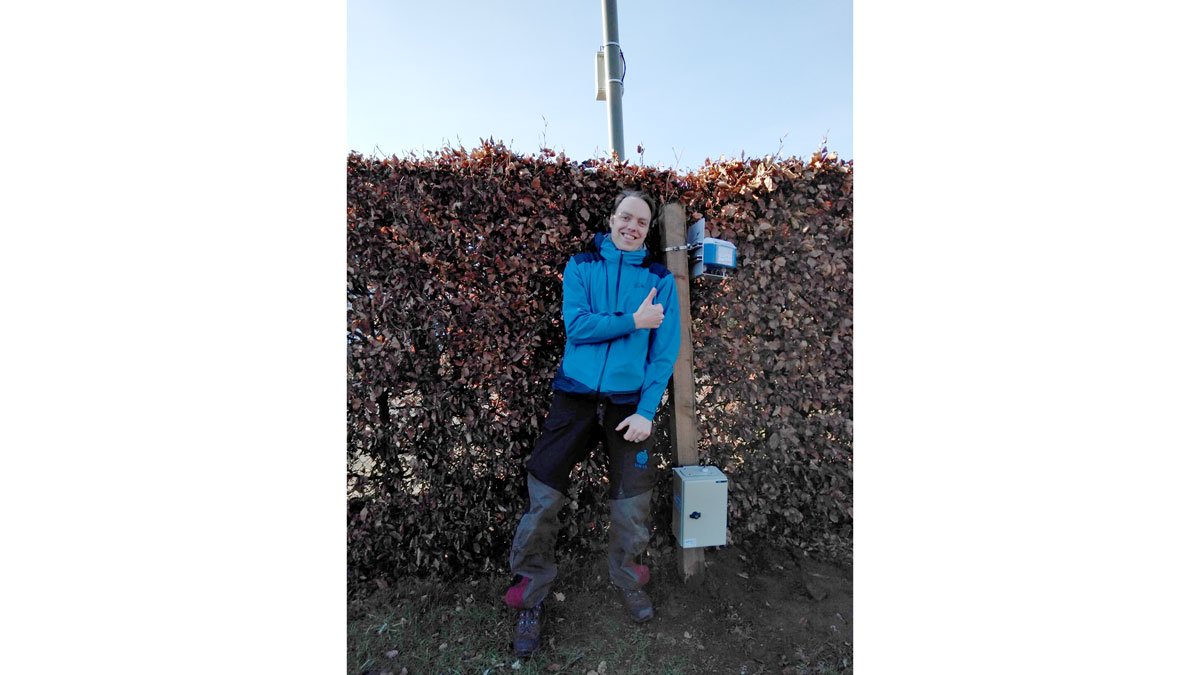 Man standing with air measuring equipment