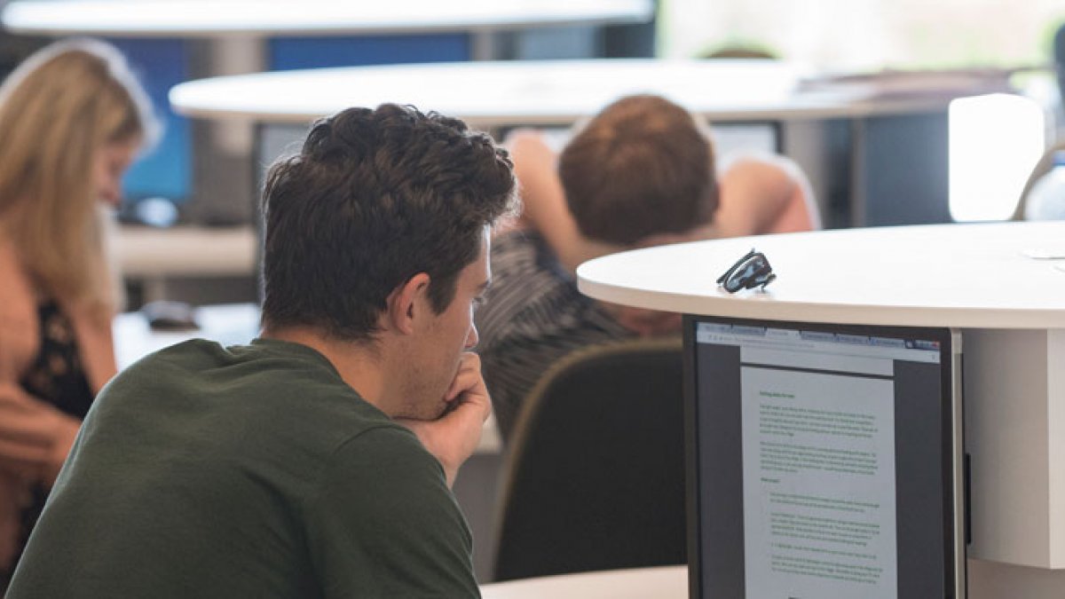 Students working in the computing area within the Innovation for Health building