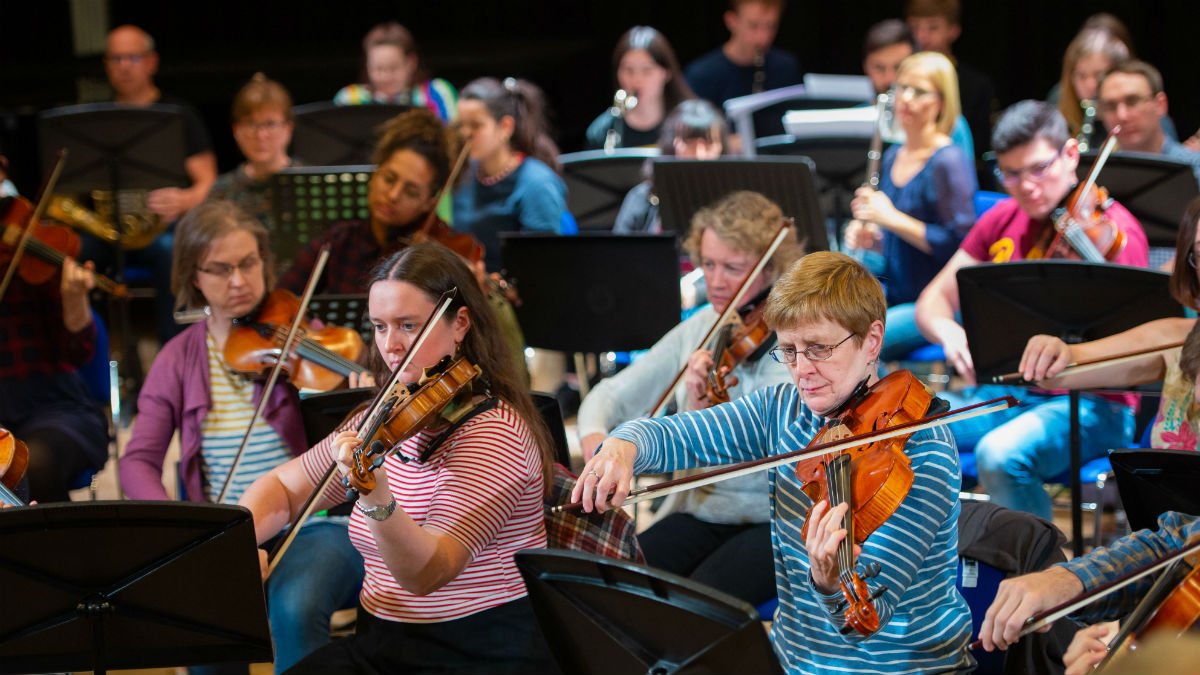University of Surrey's Orchestra are playing instruments in PATS Studio