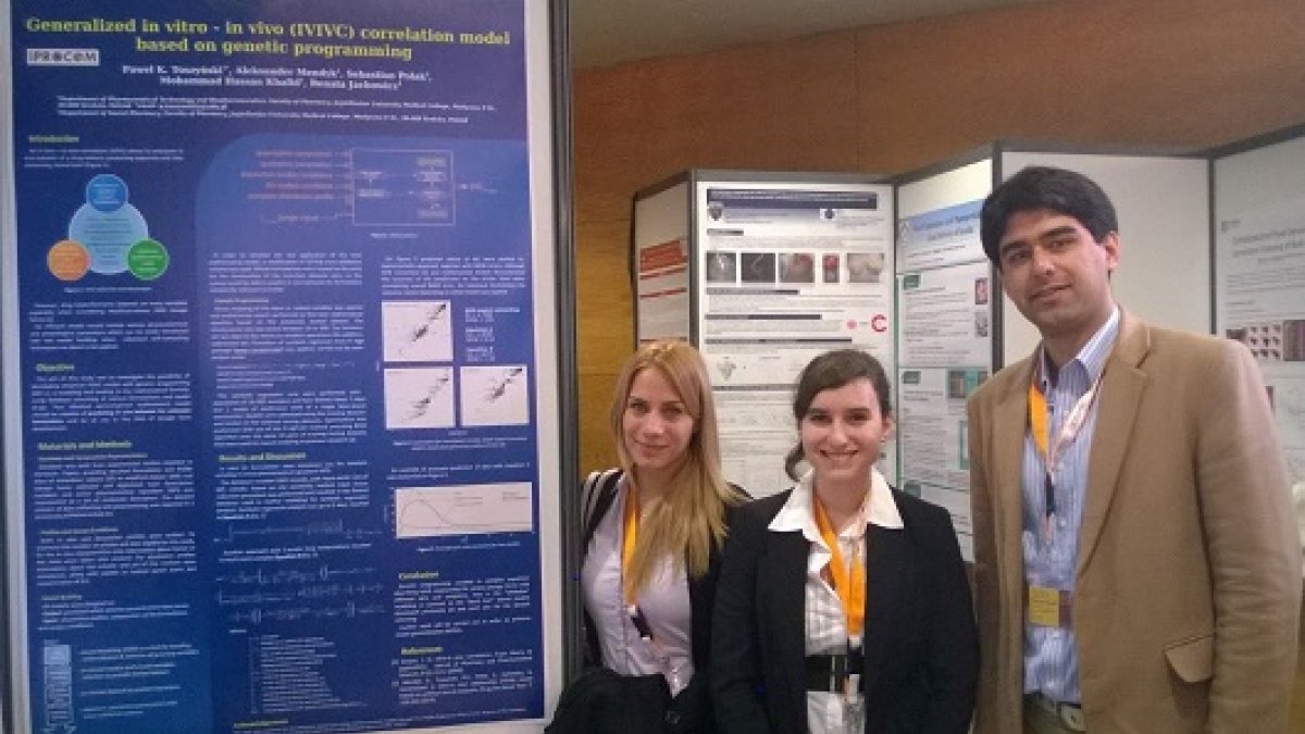 Mohammad Hassan Khalid and colleagues in front of poster