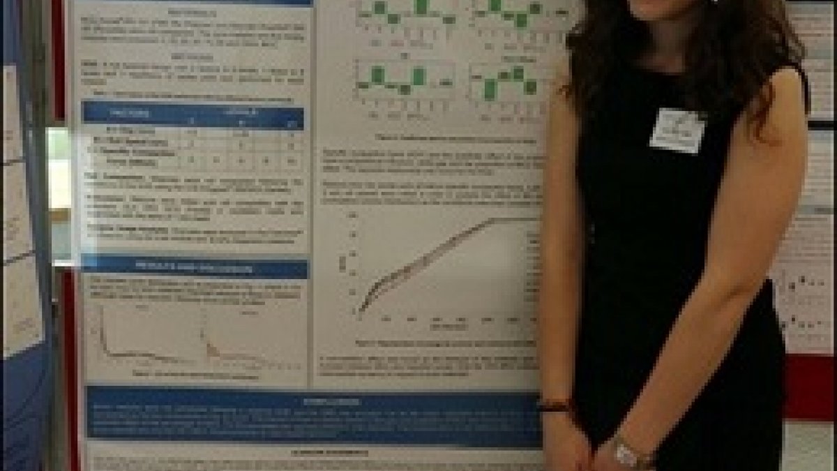 Ana Pérez Gago standing in front of her poster