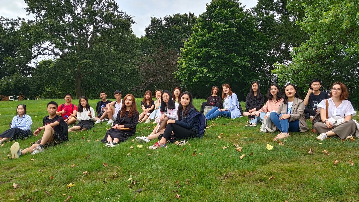 Students sat on the grass