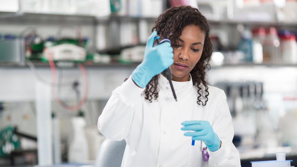 Female student holding pipette