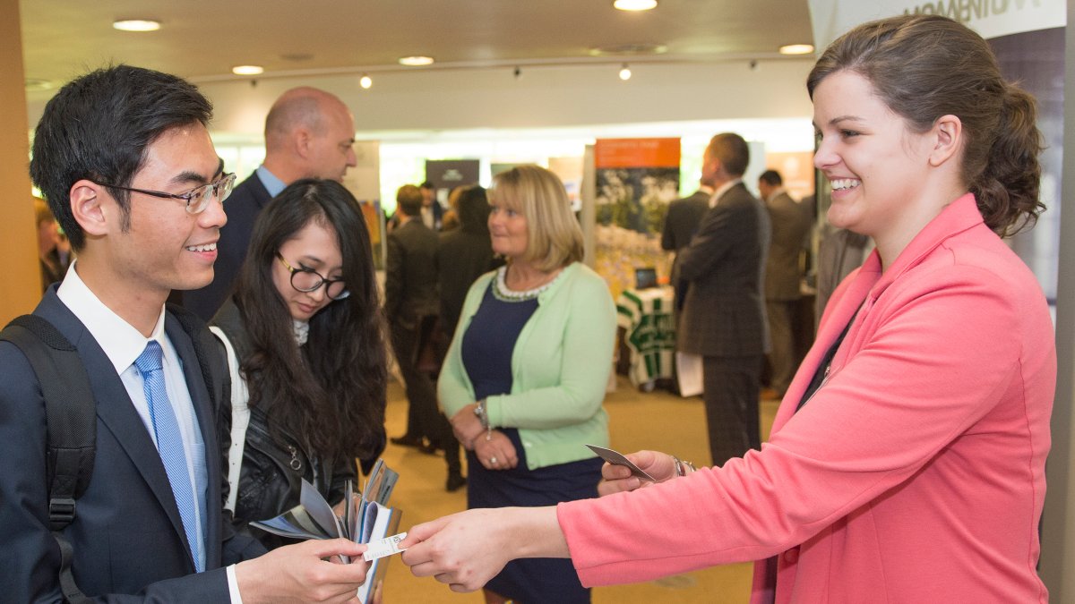 Male student speaking to prospective employer