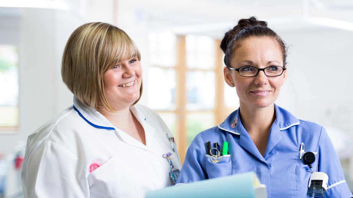 Student nurse with healthcare professional