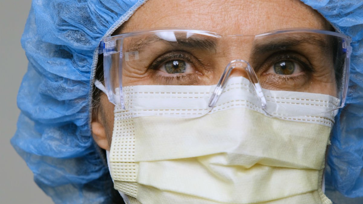 Woman in a mask and scrub cap