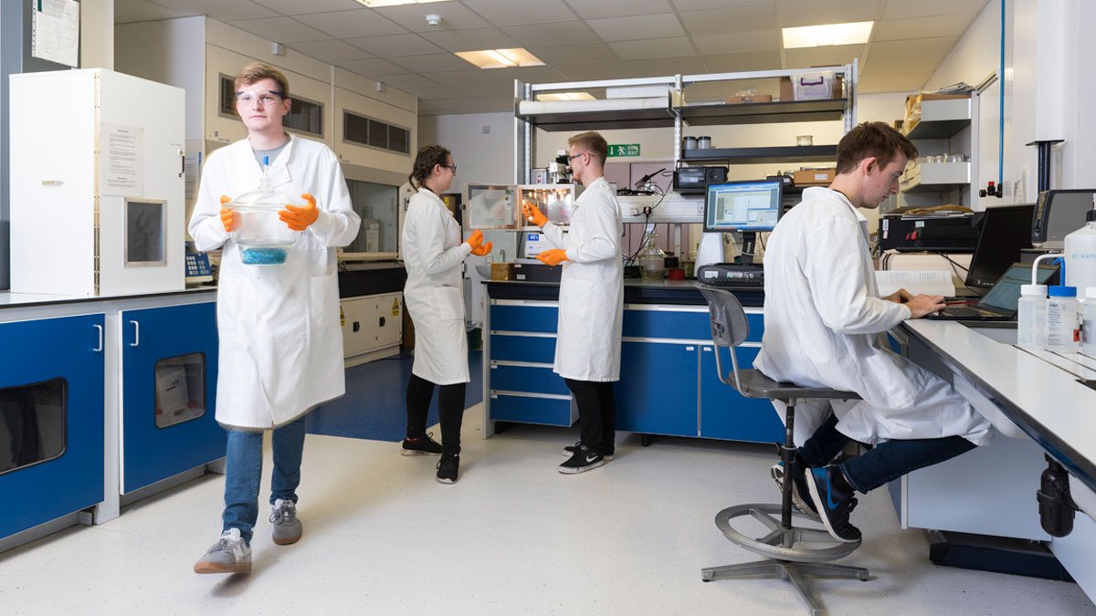 Physics students in a lab