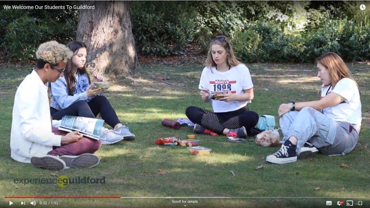 Students enjoying a socially distanced lunch in the Guildford Castle grounds