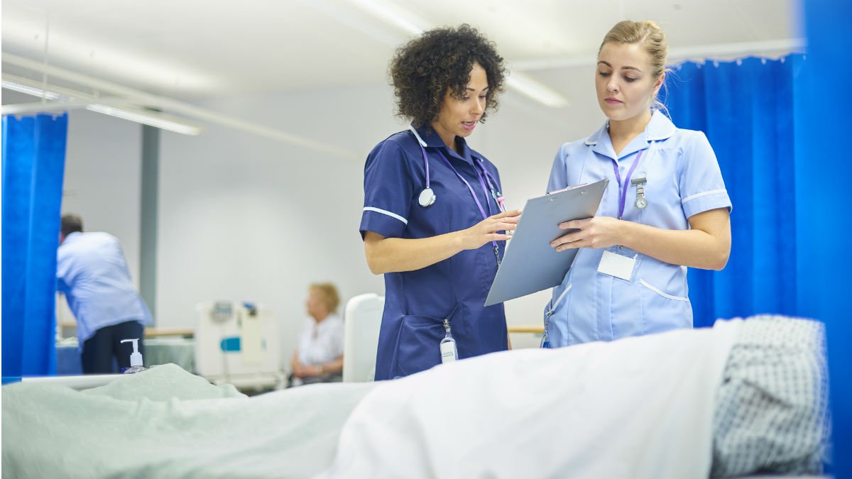 Nurses discussing a chart