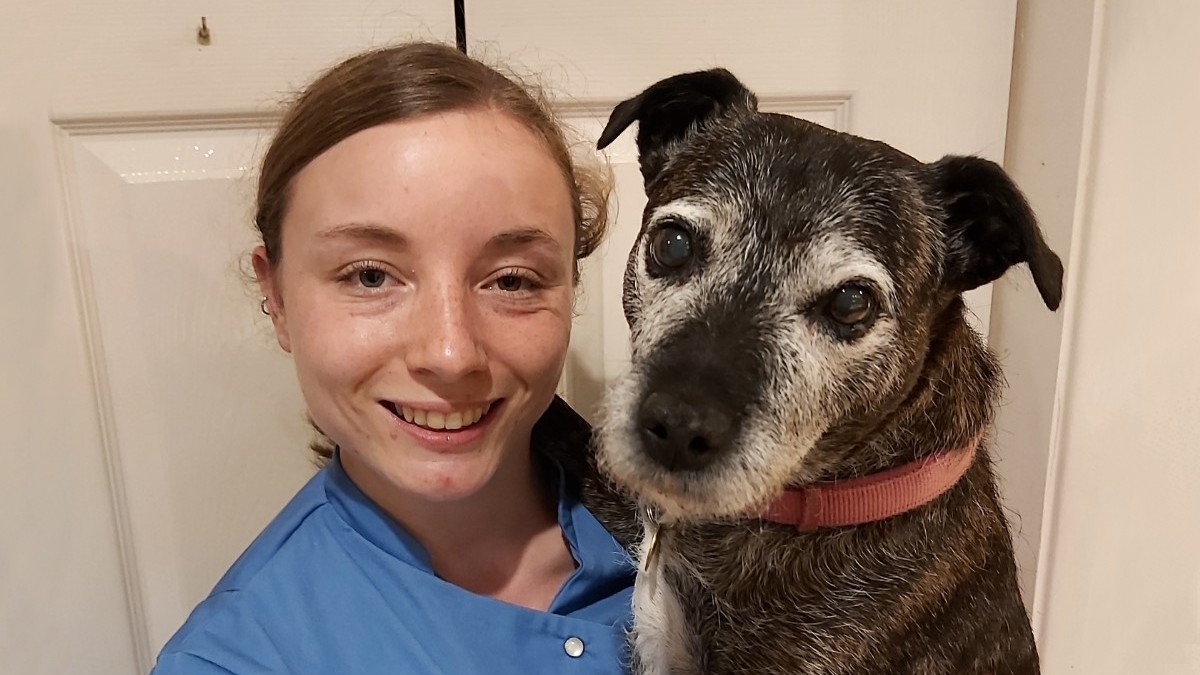 Tamsin Riley holding her pet dog