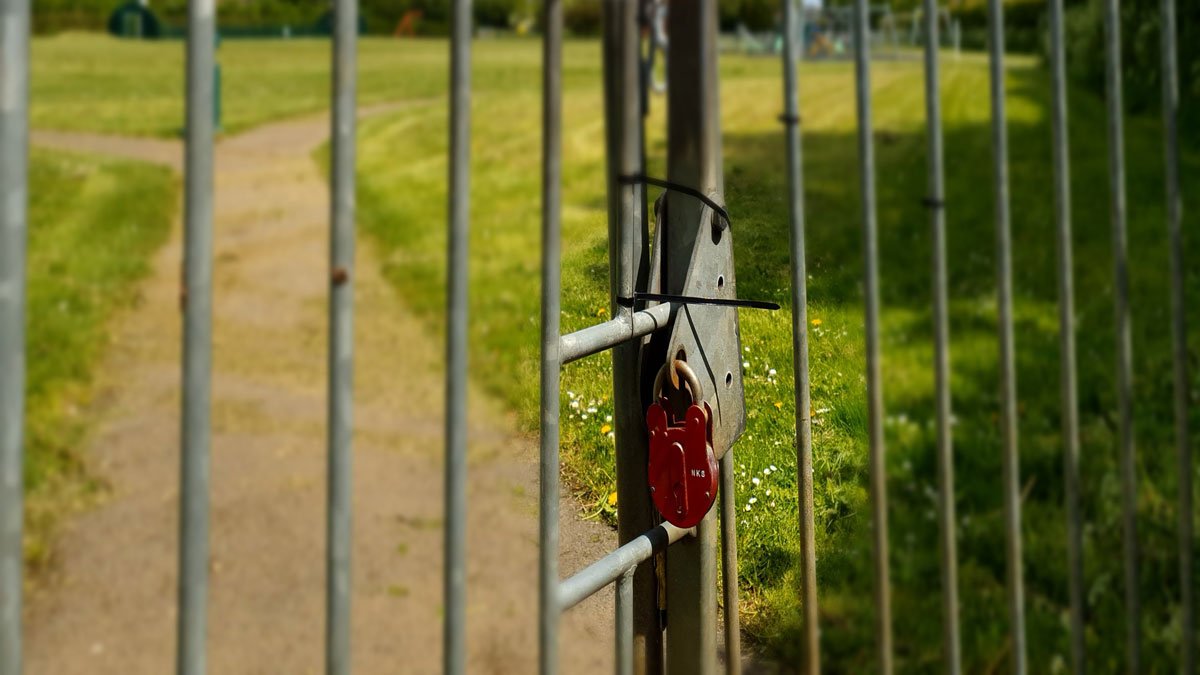 A padlock on a locked gate