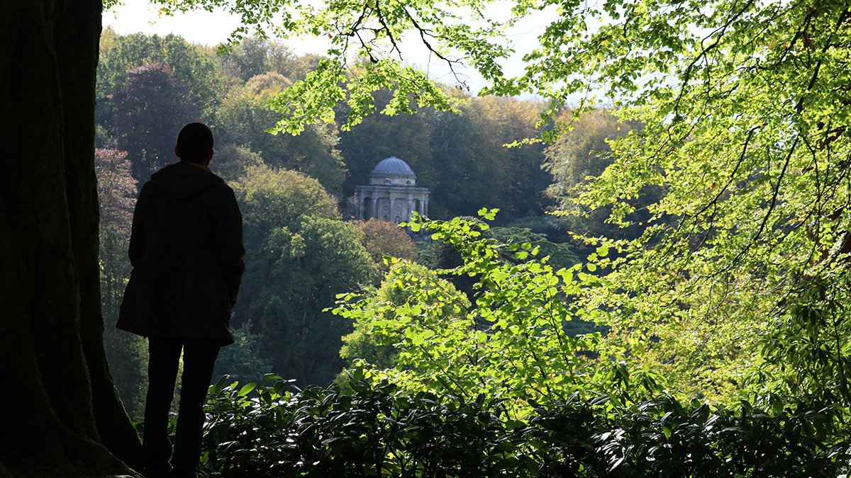 a man looking at Stourhead