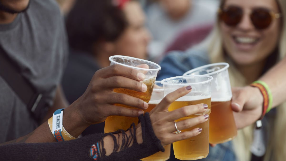 Students cheering with beers in plastic cups