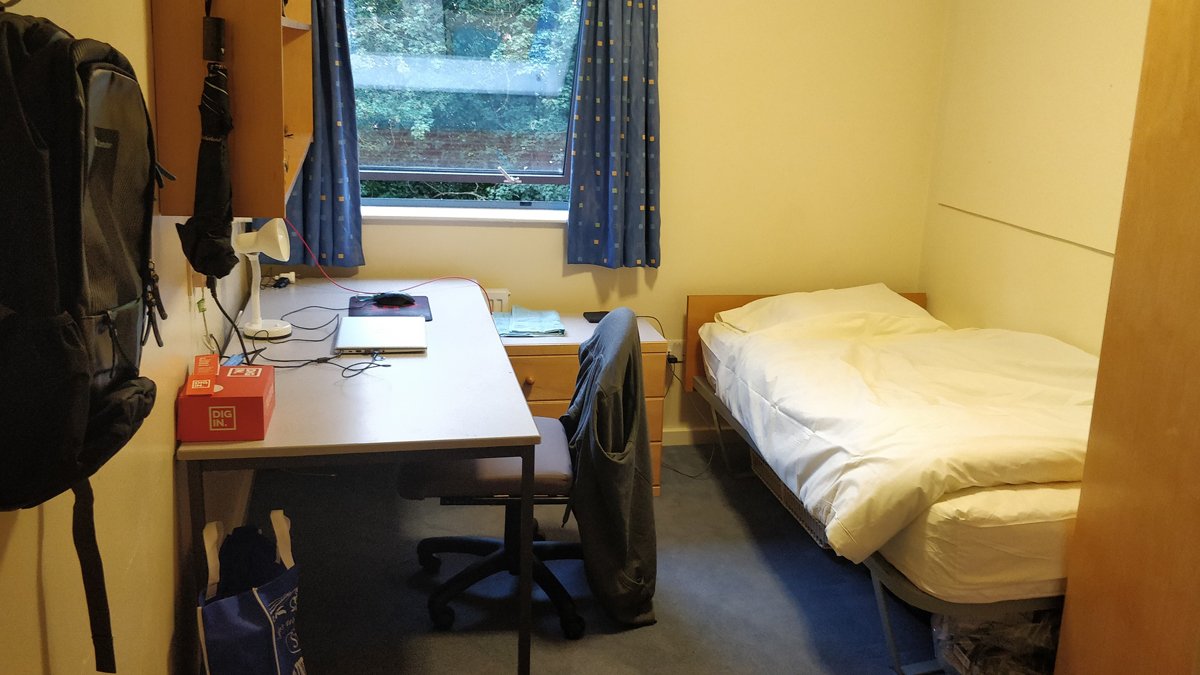 A desk, chair, bed and wardrobe in a Band D room on Stag Hill campus