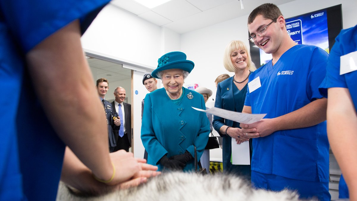 Trainee vet, Dan Letch, standing next to HM The Queen