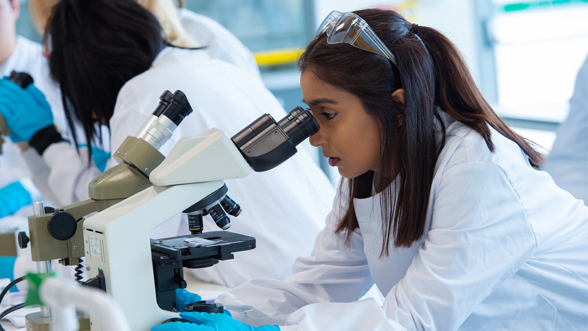 Student using a microscope