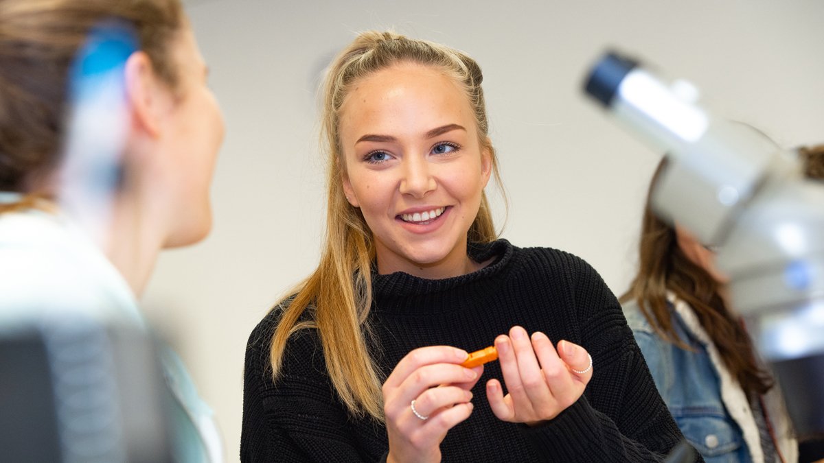 Student pricking her finger to test her blood sugar levels