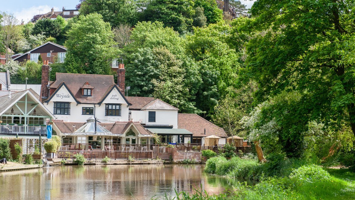 Weyside pub in Guildford with canal in foreground