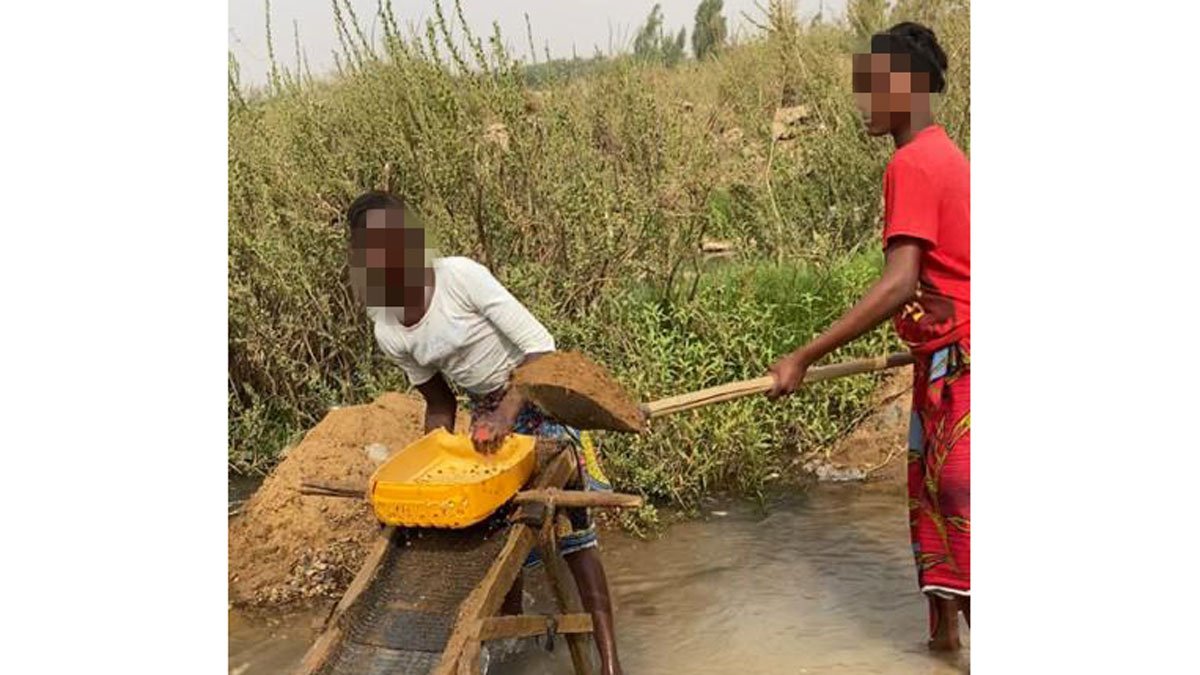 Women collecting mud.