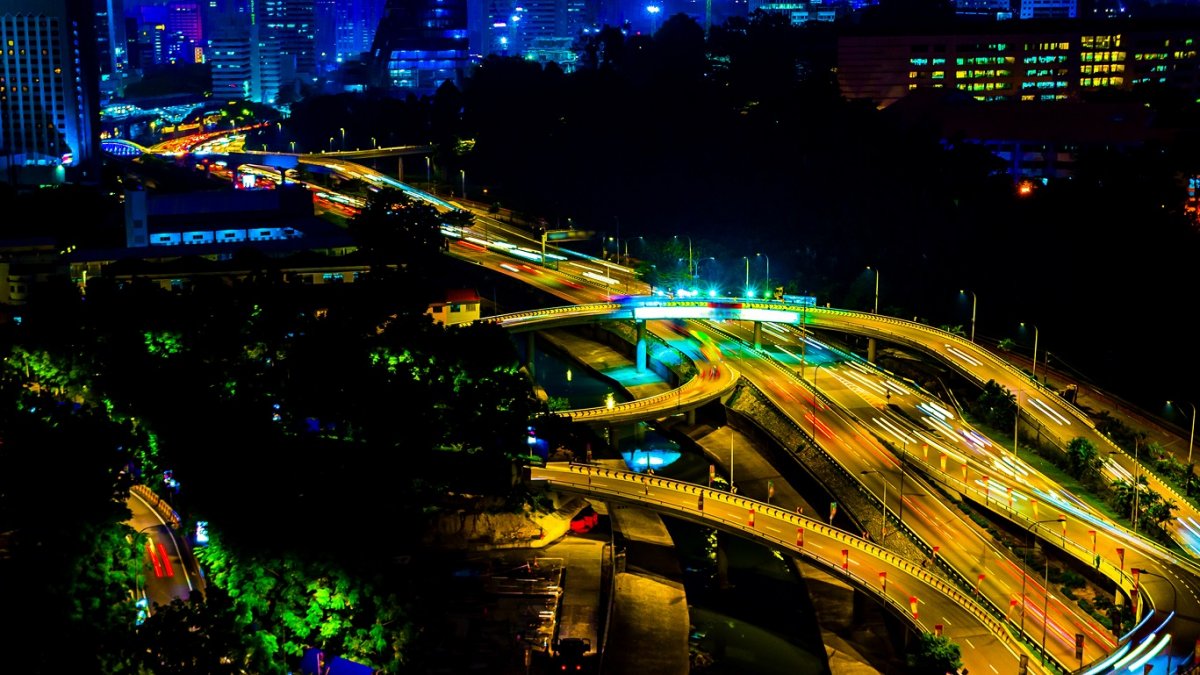 Busy intersection at night in Kuala Lumpur