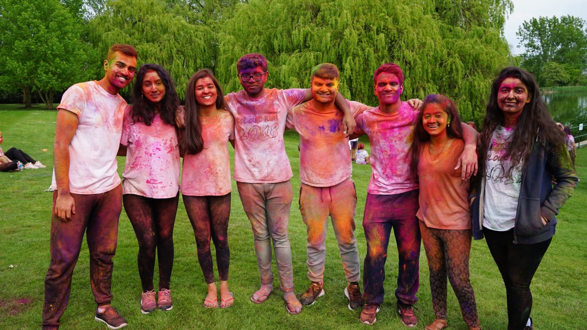 Group of students covered in paint