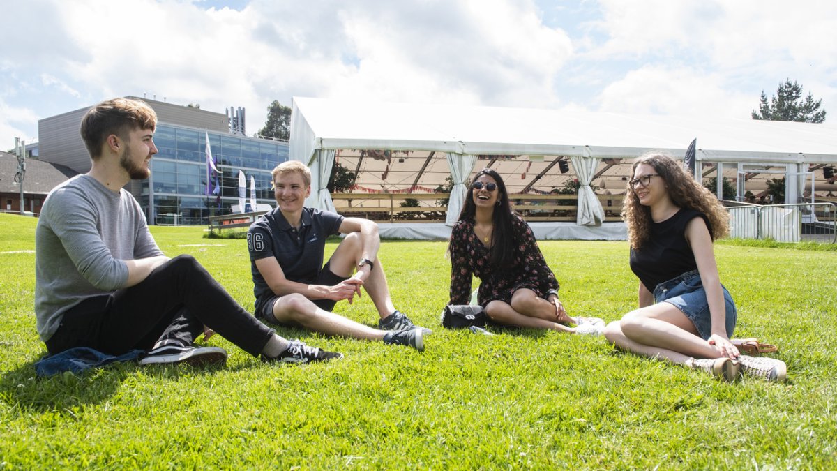 Postgraduate students sat on PATS Field