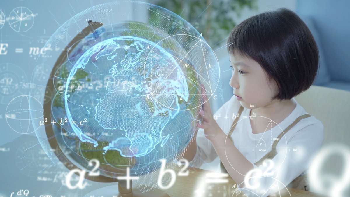 A child looks at a globe. Digital representations of information appear over the top