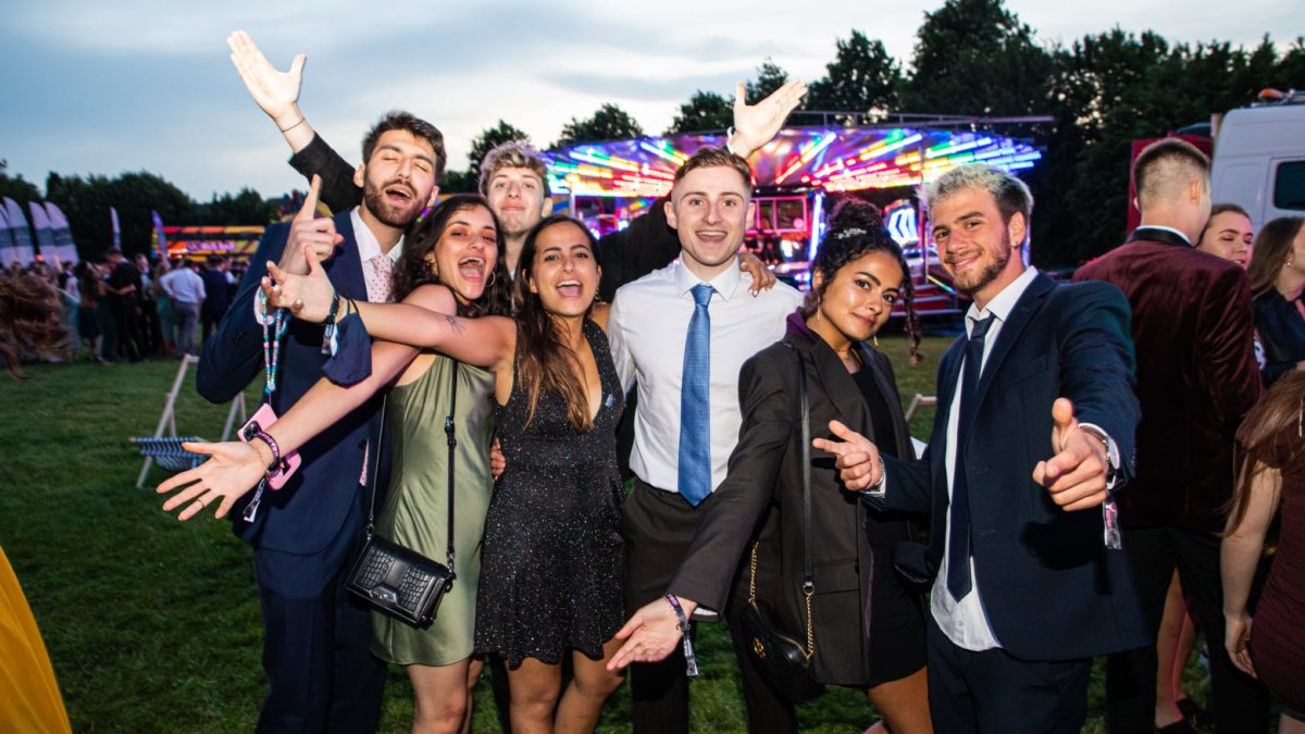 A group of graduates celebrating at Graduation Ball