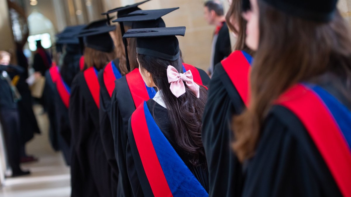 Graduands walking towards the stage in the Cathedral
